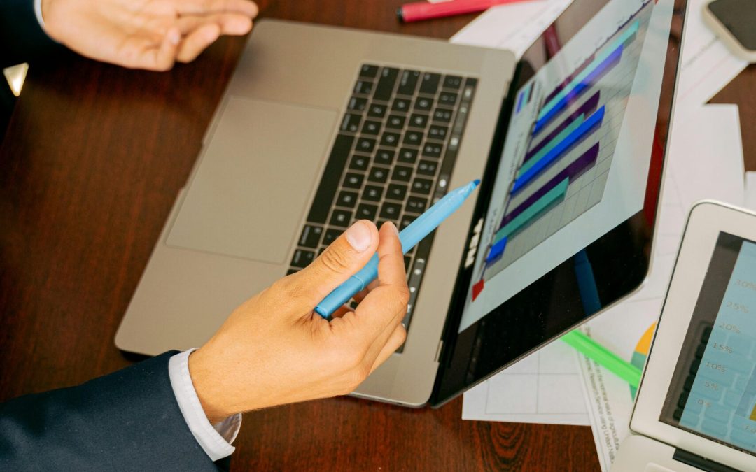 Free A Person in Black Suit Holding a Pen Stock Photo